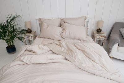 neutral linen bedding in small minimalist bedroom